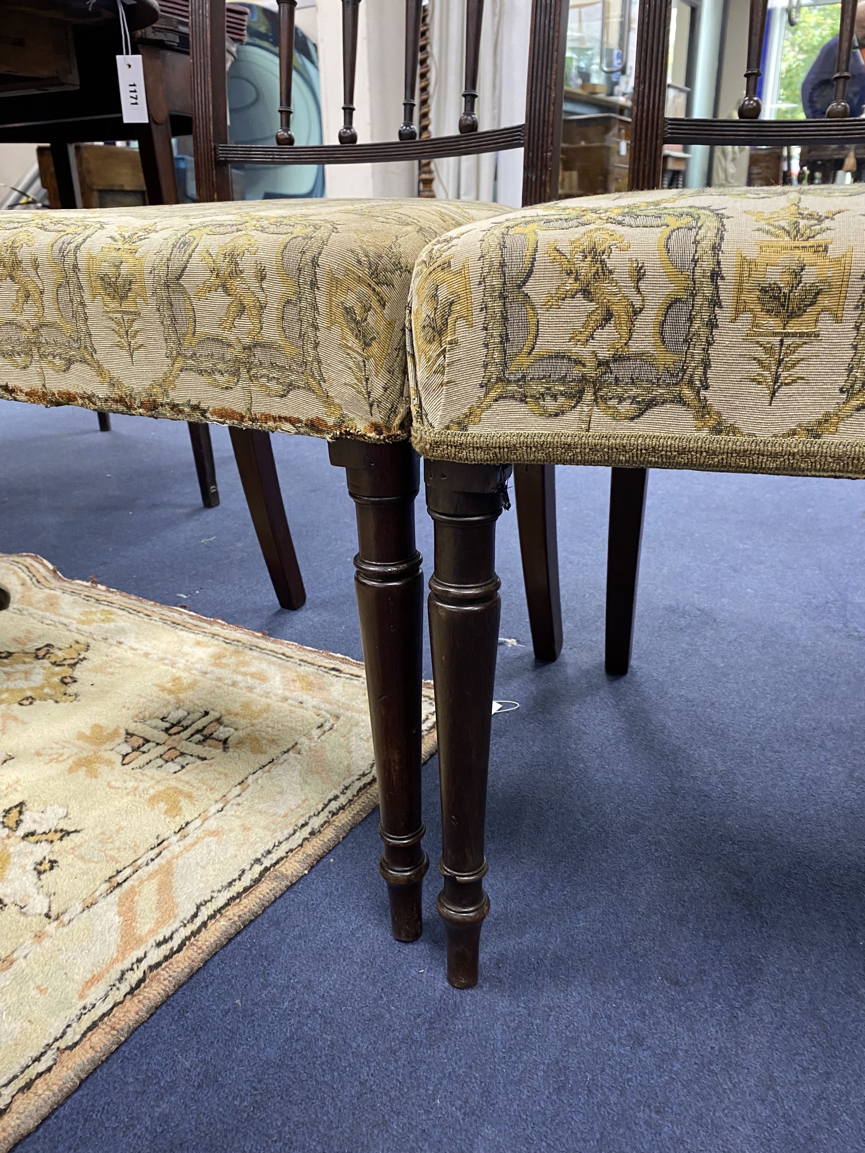 A set of four George III mahogany dining chairs